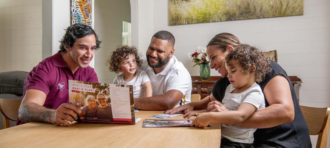 Family with JT sitting at a table